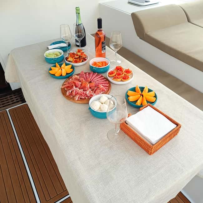 Polignano a Mare: Catamaran Tour with Aperitif & Local Food - Exploring Lama Monachile from the Water