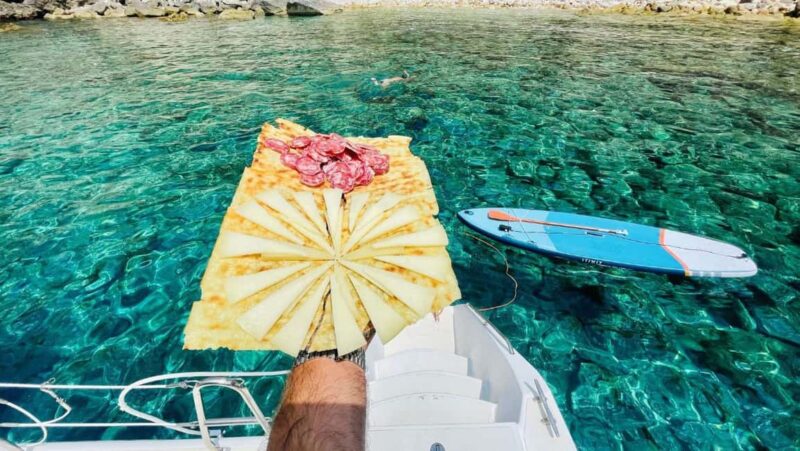 Porto Conte: Sunset catamaran excursion with aperitif - Cala Bramassa: A Quiet Cove for Sunset Swimming