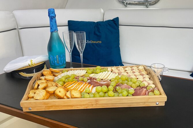 Porto: Private Yacht Cruise with Local Wine, Snacks and 6 Bridges - The Food and Drink: Local Wine, Cheese, and Cured Ham