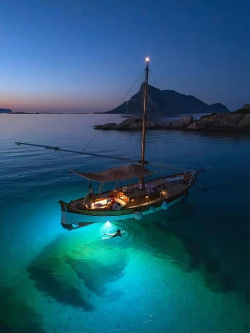 Porto San Paolo: Vintage Cruise Sunset Aperitif to Tavolara - Sunset Aperitif with Local Delicacies