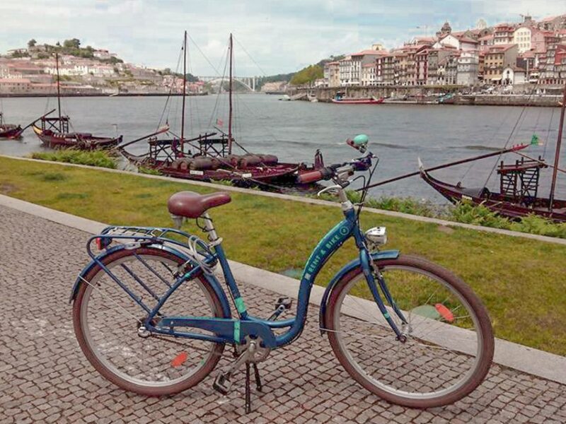 Porto: Self-Guided Bike and Boat Tour with Port Wine Tasting - Crossing the Dom Luis I Bridge to Gaia