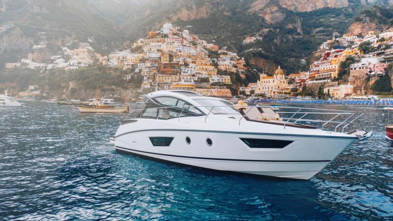 Positano Magic Experience: Secret Bays, African Caves, Champagne Cruise - Cruising Along the Coastline and Final Toast