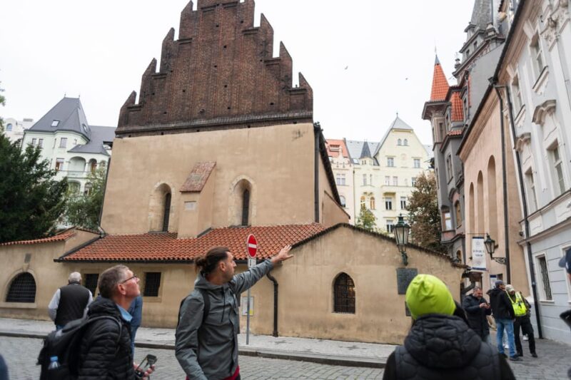 Prague: Old Town, Jewish Quarter & Astro Clock Walking Tour - Crossing the Iconic Charles Bridge