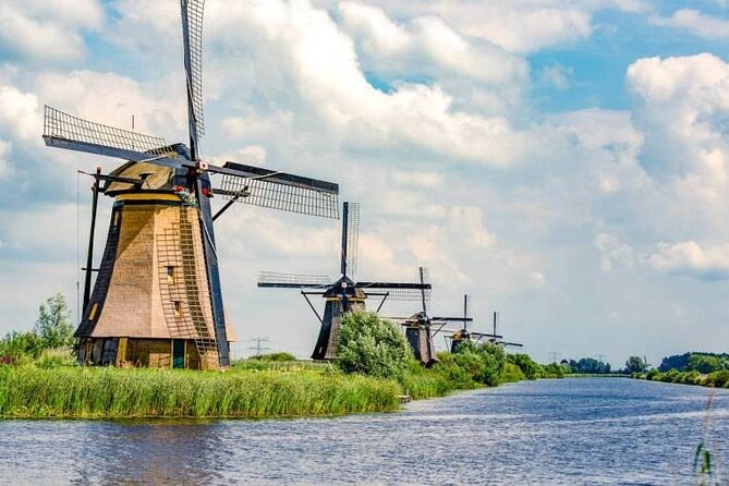 Private 8 hour Walking and Boat Tour to Rotterdam and Kinderdijk - Honoring Erasmus: The Philosopher’s Sculpture