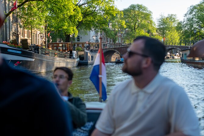 Private Boat Tour Amsterdam - 90 Min incl. welcome drink on historic saloon boat - The Route: Gliding Past Amsterdam’s Most Famous Landmarks