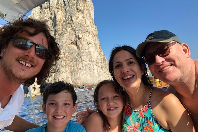 Private boat tour of the island of Capri - Passing the Iconic Faraglioni Rock Formations