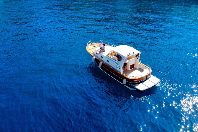 Private boat tour to Capri and Blue Grotto on Gozzo 32 ft - Iconic Landmarks: The Faraglioni Rocks and Beyond