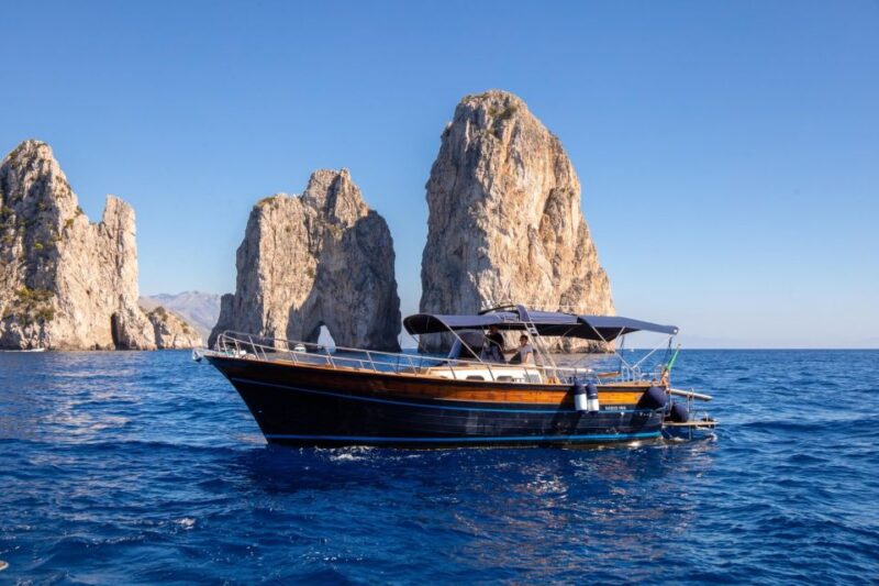 Private Capri Boat Day Tour From Sorrento or Positano - Iconic Landmarks: Faraglioni Rocks and Punta Carena Lighthouse