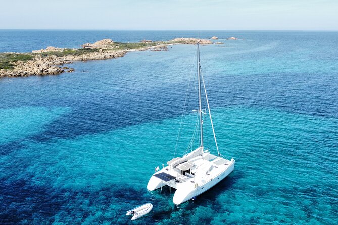 Private catamaran sailing trip around La Caletta -Berchida - Sardinia - The Experience on the Catamaran: Comfort Meets Adventure