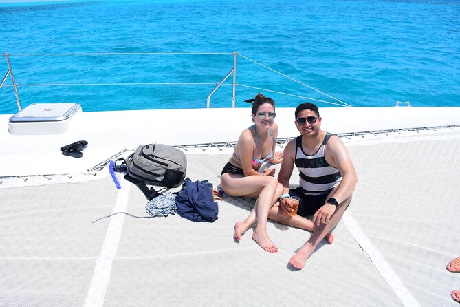 Private Catamaran to Isla Mujeres! Drinks, Party & Adventure - Unwind with Games and the Open Bar