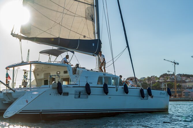 Private Catamaran Tour: Lisbon coast cruise with barbecue and drinks - Relaxing on Board: Sunbathing and Scenic Views