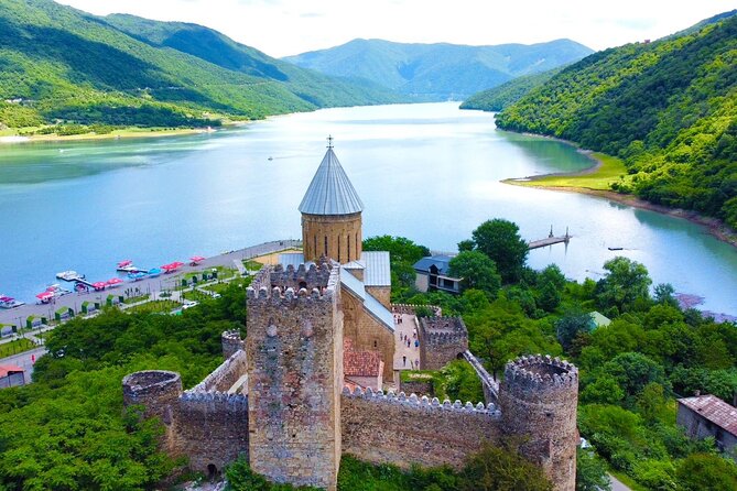 Private Kazbegi and Gudauri Mountain Tour - Standing at the Russian-Georgian Friendship Monument