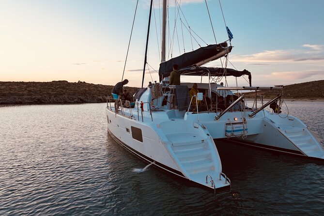 Private Mykonos Catamaran Day Cruise with Meals & Water Toys - Swimming and Snorkeling at Rhenias Secluded Coves