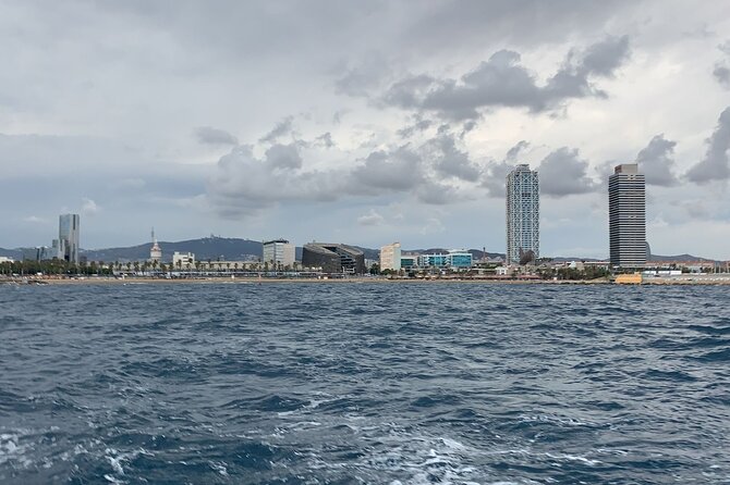 Private sailing and paddlesurfing tour with skipper up to 11 people - Observing Port Vell’s Historic and Modern Features