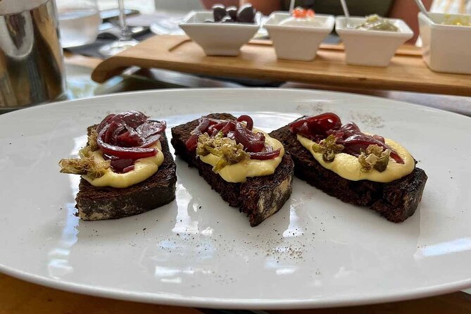 Private Santorini Wine Tour with 12 Wine Tastings and Greek Meal - The Expertise and Charm of the Private Guide