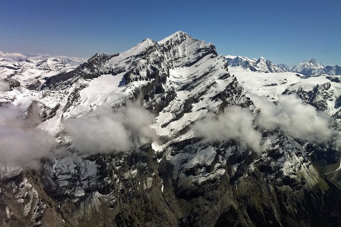 Private Swiss Alps helicopter tour over snow covered mountain peaks and glaciers - Exclusive Stops: Jungfraujoch and Schilthorn