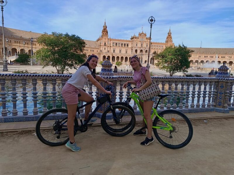 Private Tour by bike with Alcazar Guided Visit without ticket - The Majestic Plaza de España and San Telmo Palace