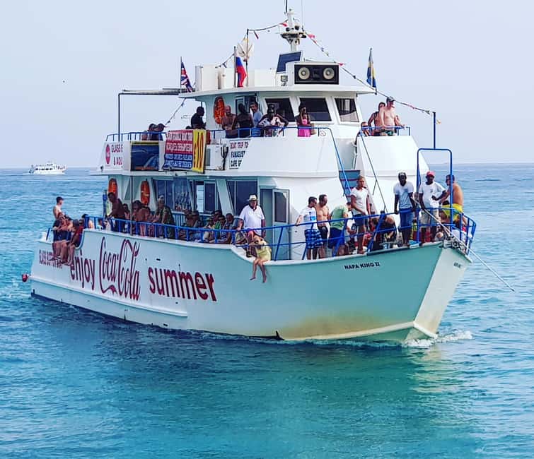 Protaras Blue Lagoon Sunset Tour with Pizza & Champagne - The Boat and Crew Experience