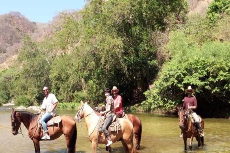 Puerto Escondido: Horseback Ride and Hot Springs Tour - Riding Through Lush Vegetation in San José Manialtepec