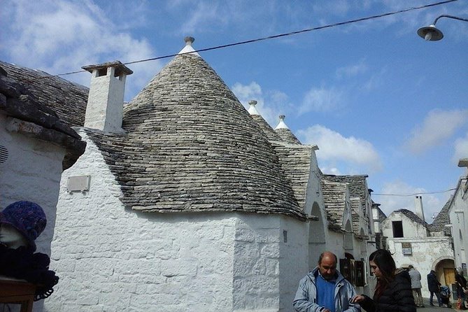 Puglia Full-Day Tour: Bari, Trulli of Alberobello, Castel del Monte and Sassi of Matera - Touring Matera’s Sassi: The Ancient Cave City