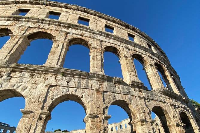 Pula Food Walking Tour - Exploring Pulas Iconic Amphitheatre and Roman Gateways