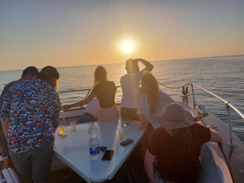 Pula: New Year Special Dolphin Sunset Cruise & Dinner - Sunset and City Lights Over Pula