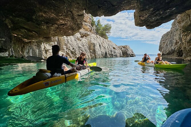 Pula: Sea Cave Kayak Tour with Snorkeling and Swimming - Visiting the Iconic Tarzan Cliff for Cliff-Jumping and Swimming