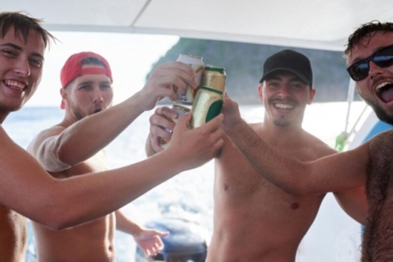 Rhodes: Bay to Bay Swim Cruise with Greek Buffet and Wine - The Atmosphere on Board: Music, Food, and Friendships