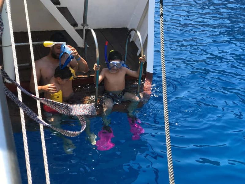 Rhodes: Boat trip to Symi island with swimming at St. George - Return Journey and Optional Hotel Transfers