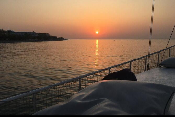 Rhodes Sunset Cruise - Swim and Dine w/ Live Music & Sunset! - Enjoying the Sunset and Rhodes’ Nighttime Illumination