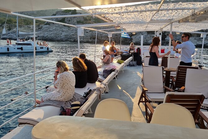 Rhodes Sunset Cruise - Swim and Dine w/ Live Music & Sunset! - Scenic Cruising Past Rhodes’ Illuminated Old Town Walls