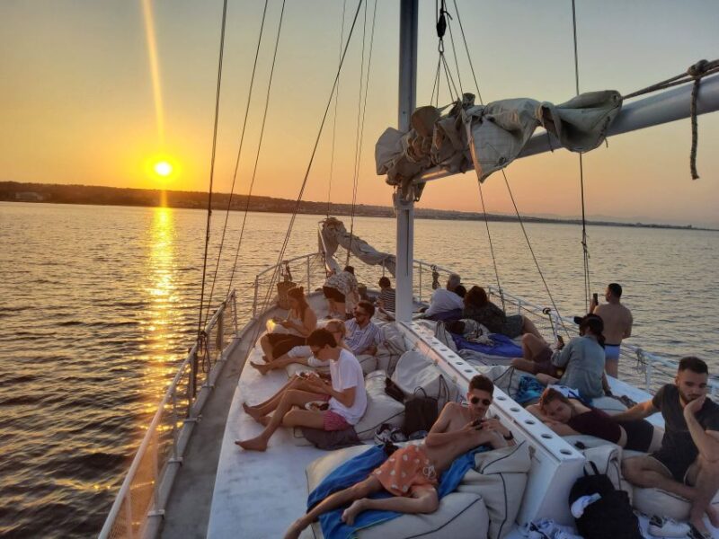 Rhodes: Sunset Cruise with Open Bar, Dinner, & Live Music - The Magic of Watching the Sunset at Sea