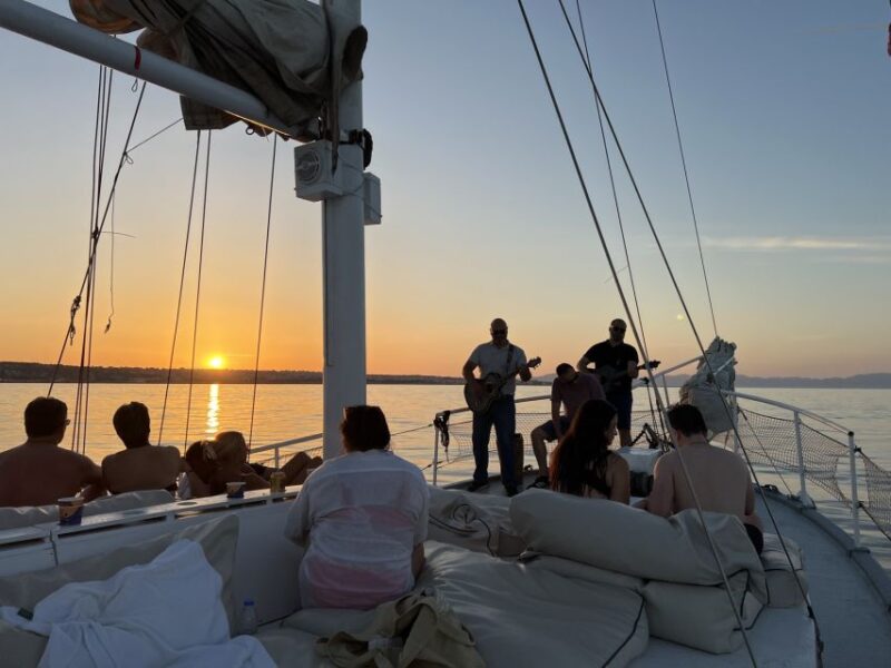 Rhodes: Sunset Cruise with Open Bar, Dinner, & Live Music - Live Music and Drinks: The Perfect Evening Atmosphere