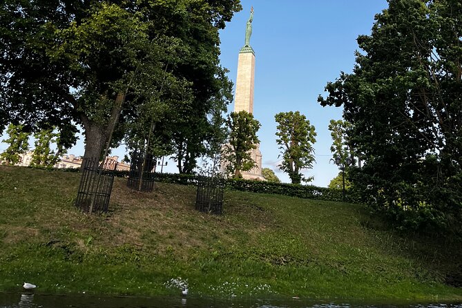 Riga Canal and Daugava Boat Tour with Welcome Drink & Audio Guide - What the Tour Includes: Drinks and Audio Guidance