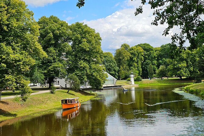 Riga: Evening or Sunset Boat Tour with Drink and Audio Guide - The Experience on Board: Atmosphere and Sound