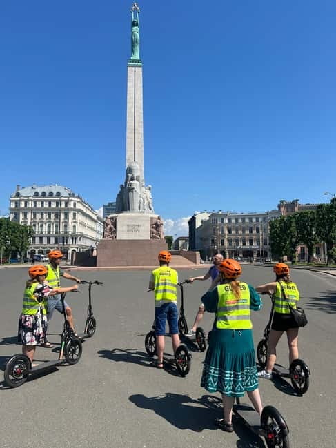 Riga Highlight Big wheel e-scooter Group or Private tour - Tour Guide Expertise and Languages