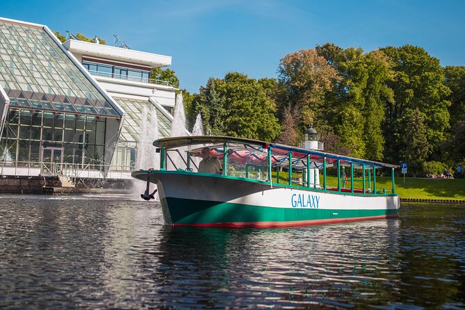 Riga Sightseeing Tour by Canal Boat with Audioguide - Crossing the Vansu Bridge and Visiting the Old Harbour