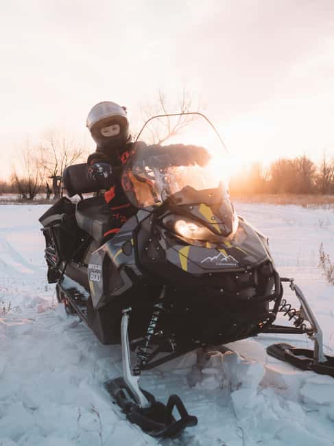 Riga: Snowmobile Adventure with Transfer - Snowmobiling Through Latvian Forests and Open Fields