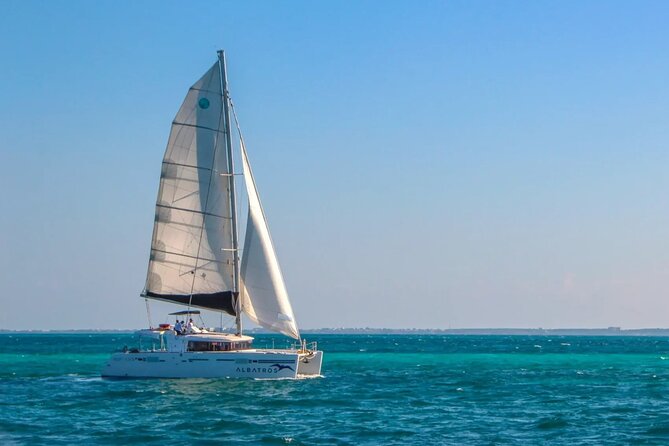 Sail to Paradise Catamaran Tour with Snorkel and Beach Club - Key Points
