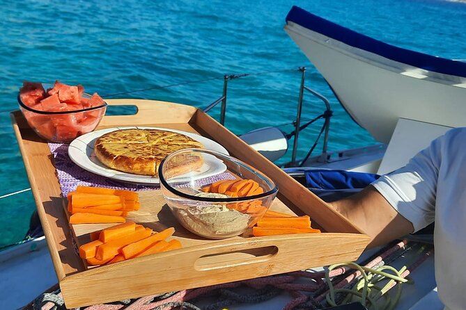 Sailing Adventure in Mallorca with Snorkeling, Tapas & drinks - Indulge in Majorcan Tapas and Refreshing Drinks Aboard