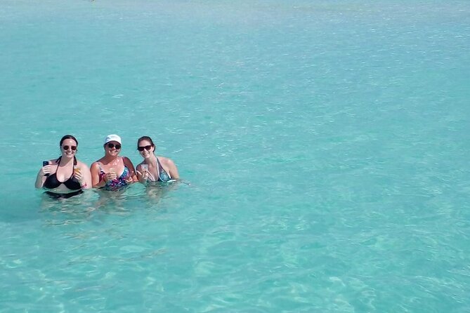 Sailing and snorkeling on a luxury catamaran to Isla Mujeres - Practical Details: Meeting Point and Additional Costs