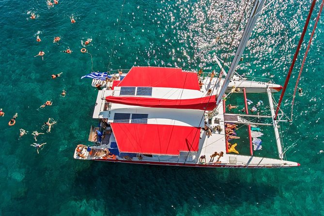 Sailing Catamaran Cruise in Santorini with BBQ, Drinks and Transfer - Starting at Ammoudi or Athinios Port for a Scenic Departure