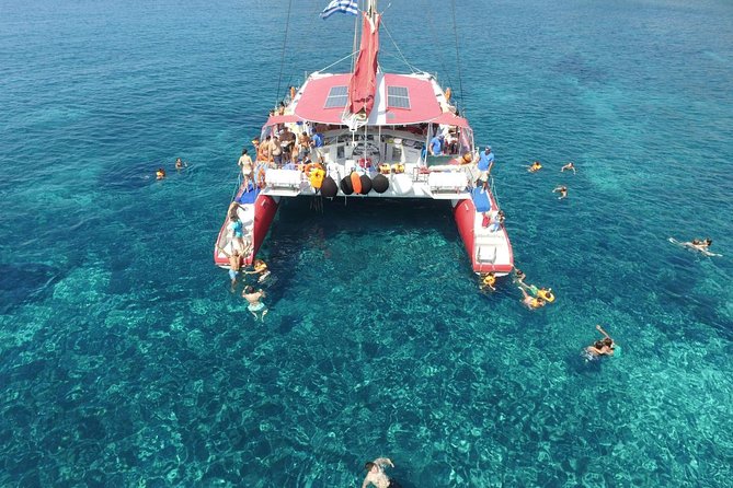 Sailing Catamaran Cruise in Santorini with BBQ, Drinks and Transfer - Relaxing at White Beach with a Barbecue Feast