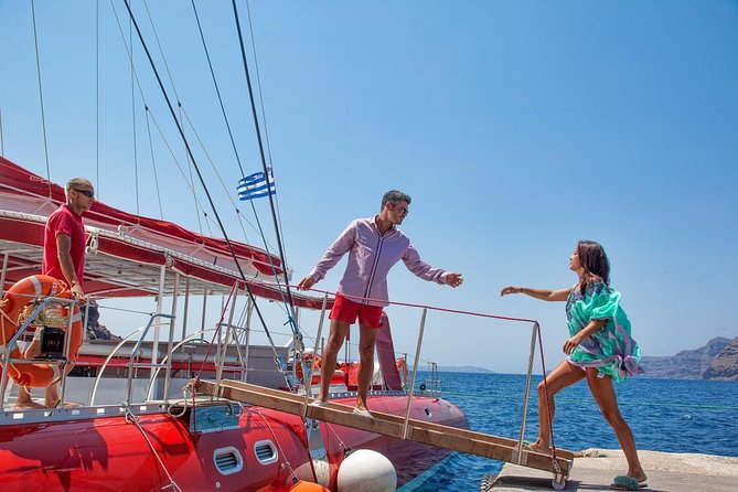 Sailing Catamaran Cruise in Santorini with BBQ, Drinks and Transfer - Onboard Comforts and Entertainment