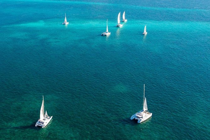 Sailing Catamaran with Open Bar to Isla Mujeres - Setting Sail on a Lively Caribbean Cruise