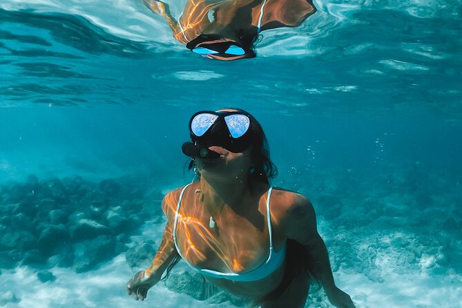 Sailing Cruise to Dia Island with Meal and Water Activities - Water Activities: Snorkeling, Paddleboarding, and Fishing Equipment