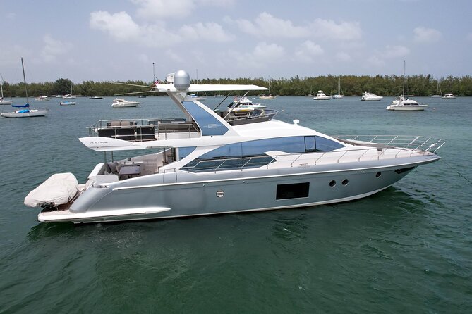 Sailing into the sunset on a personalized luxury Yacht Charter - Visiting the Iconic Haulover Sandbar