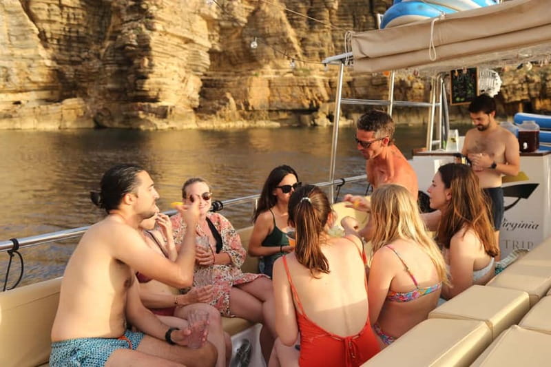 San Antonio: Cala Salada & Cala Gracio Sunset Boat Trip - Sunset at Café del Mar and Mambo Bay