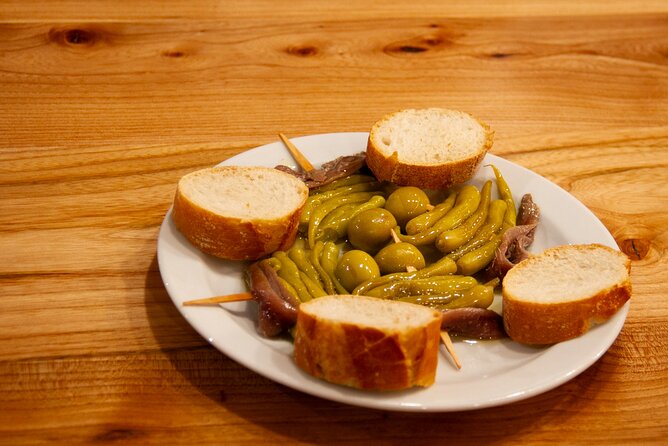 San Sebastian Walking Food Tour With Secret Food Tours - Tasting Basque Cider and Learning How to Pour It