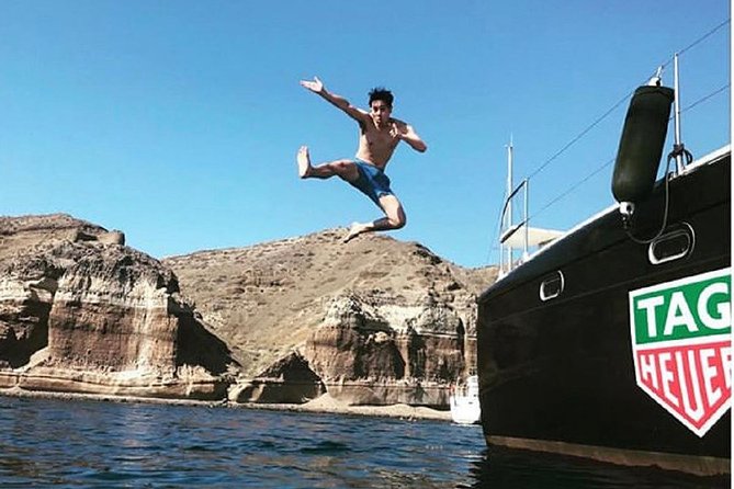 Santorini Adventurous Catamaran Experience with Snorkeling - Journey through Santorini’s Caldera on a Vintage Sailboat